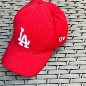 Red dodgers baseball cap.  21 inches around